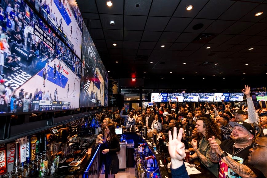 People watching Timberwolves game at Toms Watch Bar